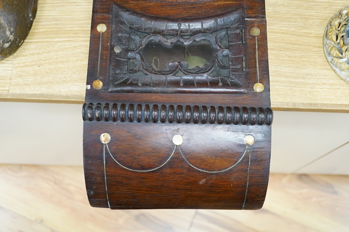 A late 19th century mahogany wall clock with mother of pearl inlaid discs, with pendulum and key, 67cm high